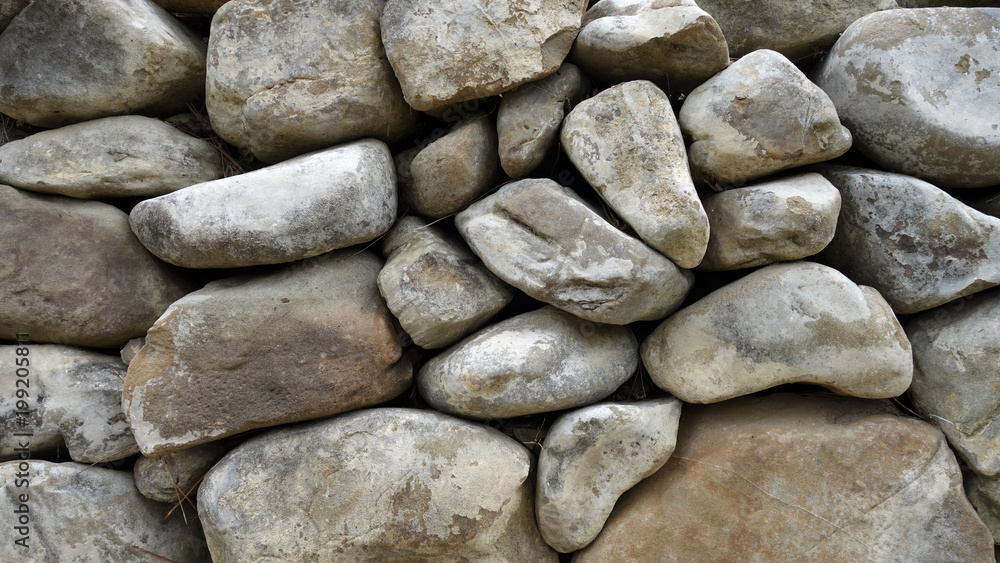 Garden stonewall made of natural materials (small stones) Garden stonewall made of natural materials (small stones)