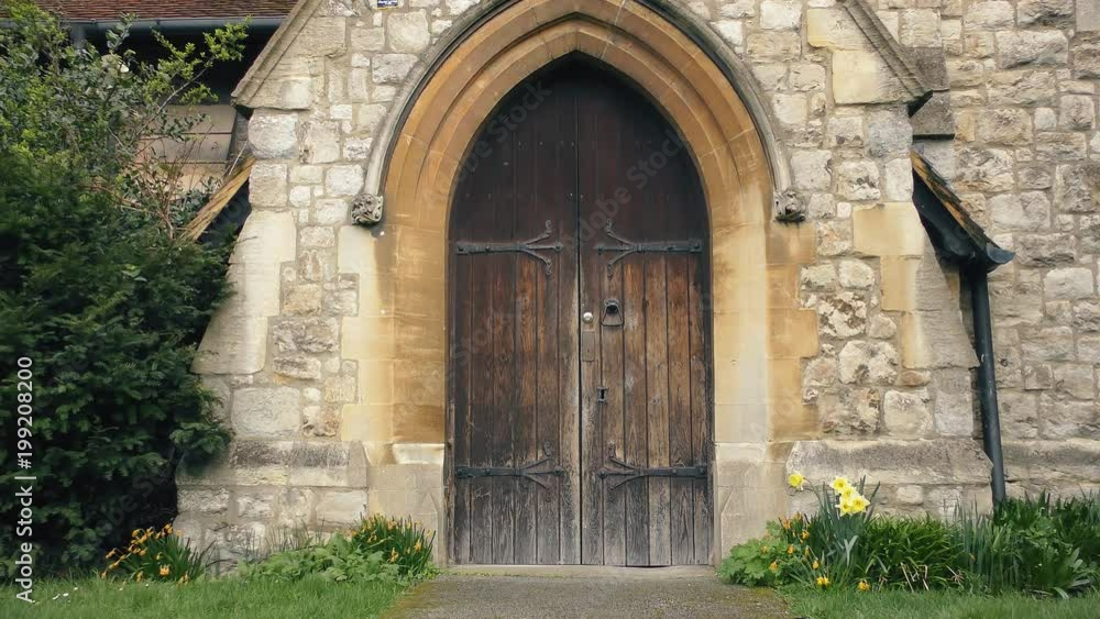 Wooden door of an old stone building. Wooden door of an old stone building.