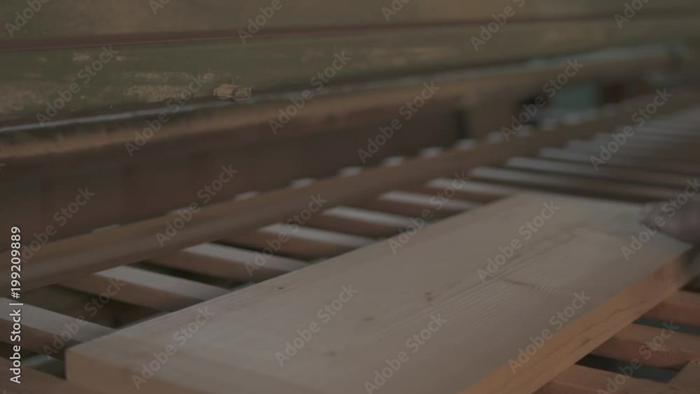 Sanding and verifying a wooden plank Sanding and verifying a wooden plank