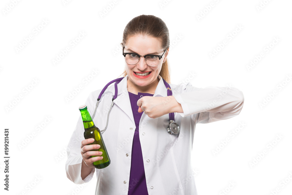 Attractive caucasian brunette female doctor standing in office with bottle of beer in her hands showing prevention sign on white background Attractive caucasian brunette female doctor standing in office with bottle of beer in her hands showing prevention sign on white background