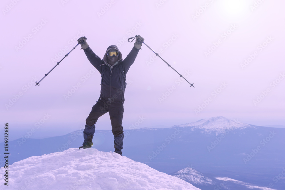 mountaineer exults reaching the top of the mountain peak.. mountaineer exults reaching the top of the mountain peak..