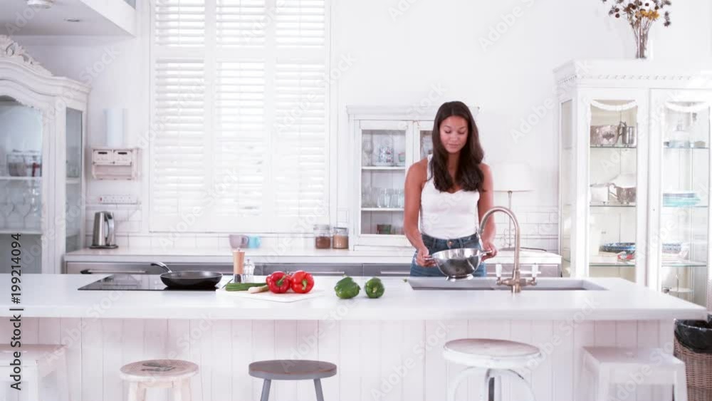 Woman cooking in modern kitchen slow motion Woman cooking in modern kitchen slow motion