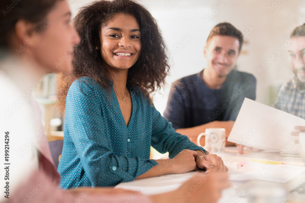 Obraz premium Portrait of a young black woman looking in a work meeting