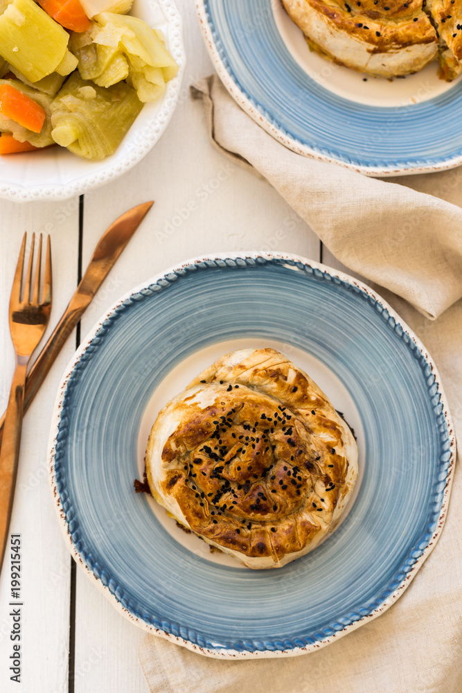 Turkish pastry borek in blue ceramic plates Turkish pastry borek in blue ceramic plates