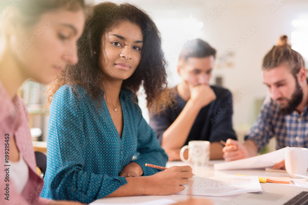 Portrait of a young black woman looking in a work meeting Portrait of a young black woman looking in a work meeting