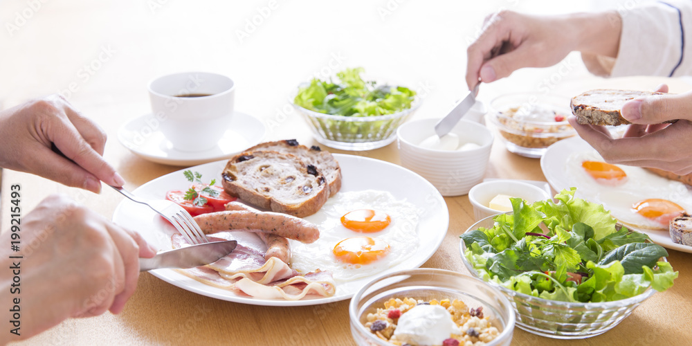 A couple eating breakfast A couple eating breakfast
