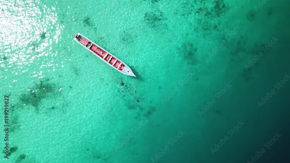 Aerial view from a drone of a traditional fishing boat on sunny day in Myanmar sea
Aerial view from a drone of a traditional fishing boat on sunny day in Myanmar sea