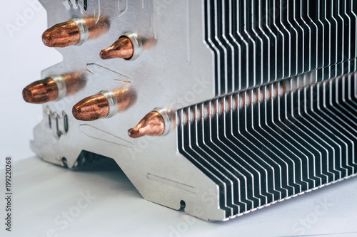 Aluminum radiator with copper heat pipe close-up with beautiful bokeh photo