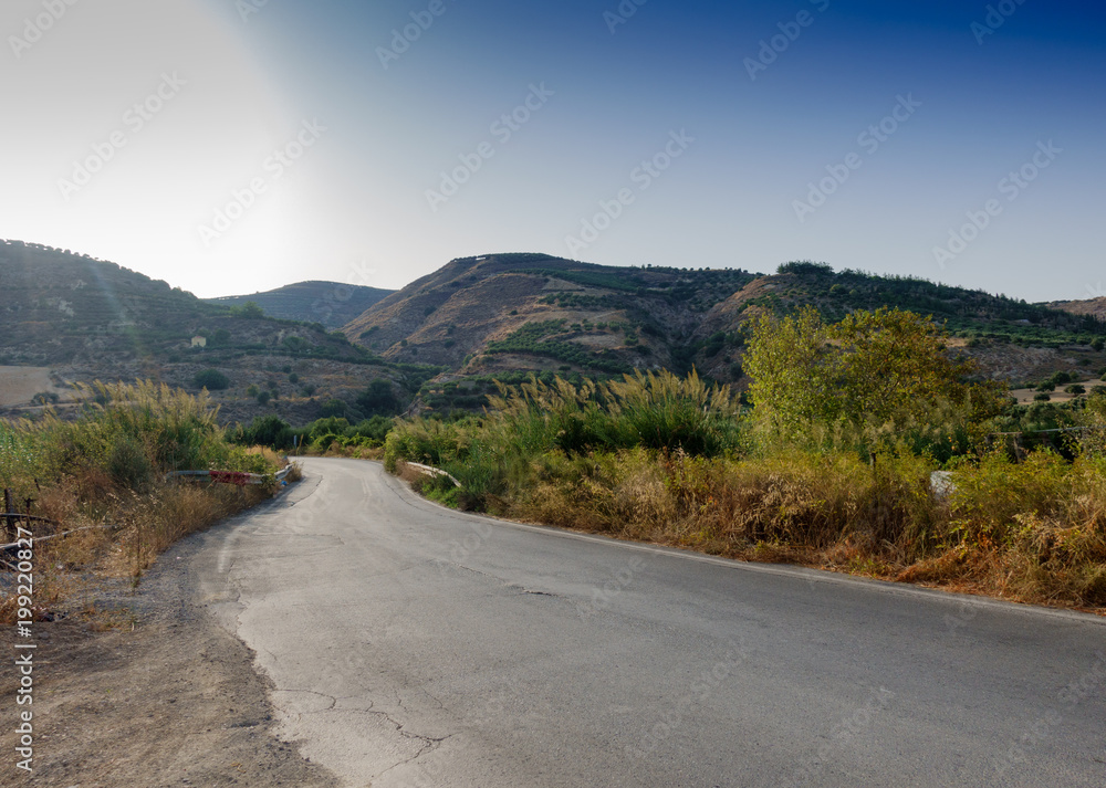Road leading towards mountain, Crete, Greece