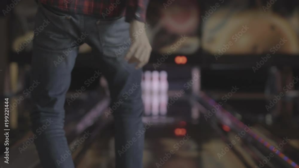 A player throwing a gutter ball A player throwing a gutter ball