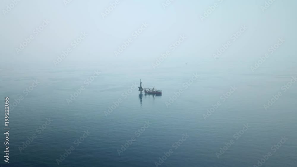 Aerial view from a drone of a tender assisted drilling rig in the middle of the ocean view
Aerial view from a drone of a tender assisted drilling rig in the middle of the ocean view