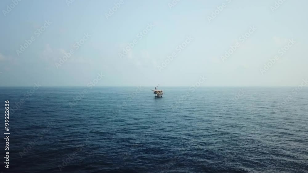 Aerial view from a drone of a small offshore platform in the middle of the ocean
Aerial view from a drone of a small offshore platform in the middle of the ocean