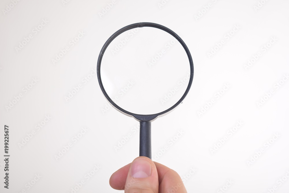 Businessman looking at a magnifying glass word: Businessman looking at a magnifying glass word:
