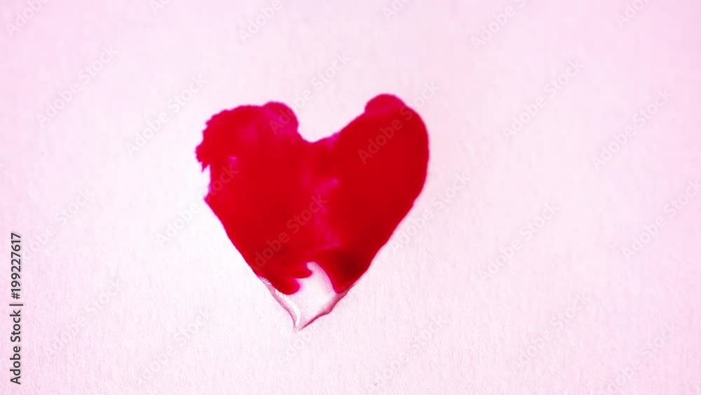 Red heart painting by splashing paint on paper Red heart painting by splashing paint on paper