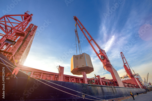 heavy lift cargo unit is on/off-loading discharging loading operation handle by the jumbo heavy crane of the ship to delivery the shipment to destination by sea and land transports