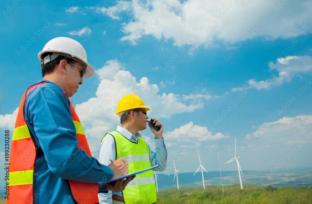 Male Engineer or technician at Work wind turbine station,wind enegy concept Male Engineer or technician at Work wind turbine station,wind enegy concept