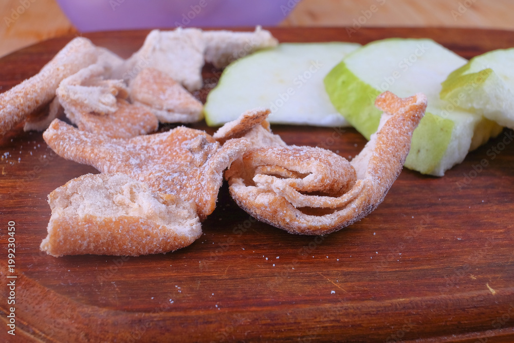 Sour orange peel and sliced guava on cutting board. Sour orange peel and sliced guava on cutting board.
