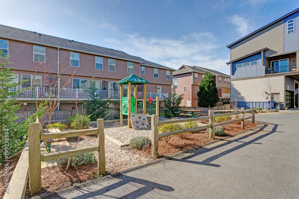 Apartment complex building with kids playground Apartment complex building with kids playground