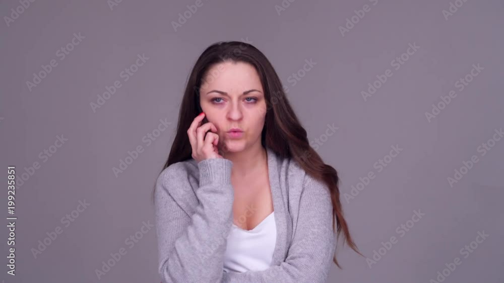 dissatisfied woman talking on the phone dissatisfied woman talking on the phone