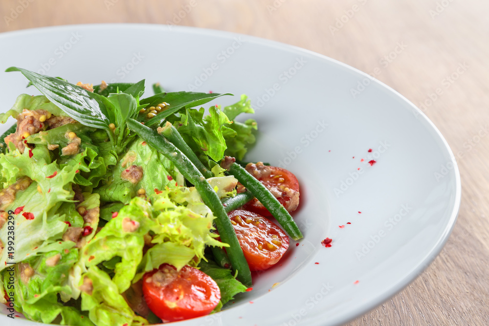 Canned tuna salad with cherry tomatoes, green beans and French mustard