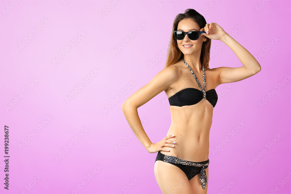 Fototapeta premium Young attractive woman in swimsuit