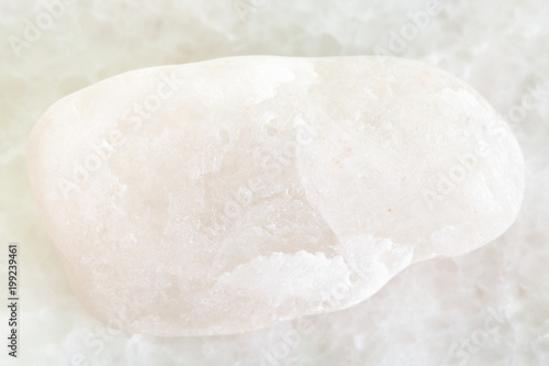 pebble of white marble on white marble background
