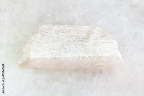 raw Talc stone on white marble
