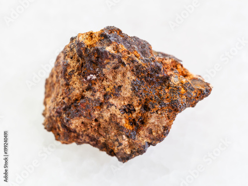 raw Hematite  iron ore  stone on white marble