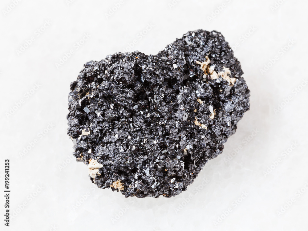 crystalline Perovskite stone on white marble crystalline Perovskite stone on white marble