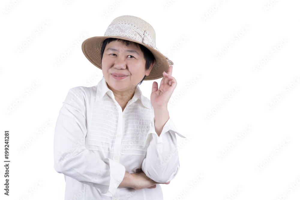 Asian Middle-aged woman in white shirt and woven hat isolated on white background Asian Middle-aged woman in white shirt and woven hat isolated on white background