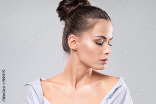 Beauty close up portrait of female face with natural skin at white background