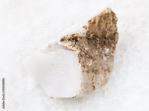 raw cacholong (white opal) stone on white photo