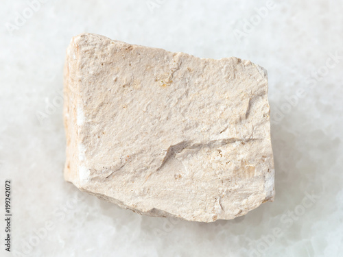 raw chemical limestone stone on white