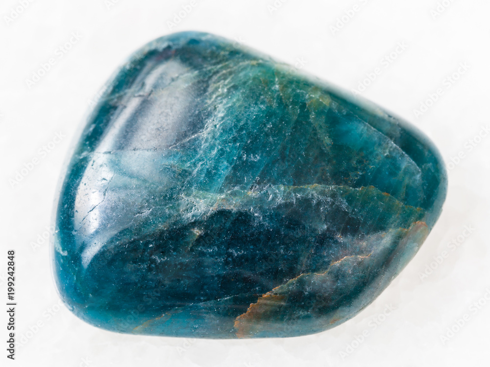 polished green blue Apatite gemstone on white polished green blue Apatite gemstone on white