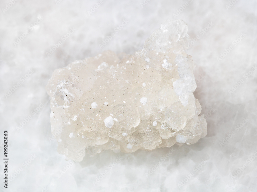 raw crystal of Prehnite with Okenite on white raw crystal of Prehnite with Okenite on white