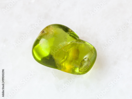 Obraz na plátně tumbled olivine gem stone on white