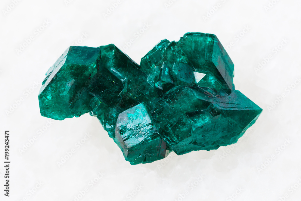 raw Dioptase crystal of gemstone on white raw Dioptase crystal of gemstone on white