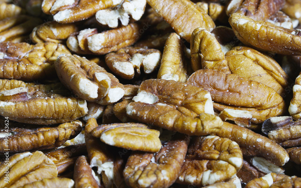 large amout of pecans close up view large amout of pecans close up view