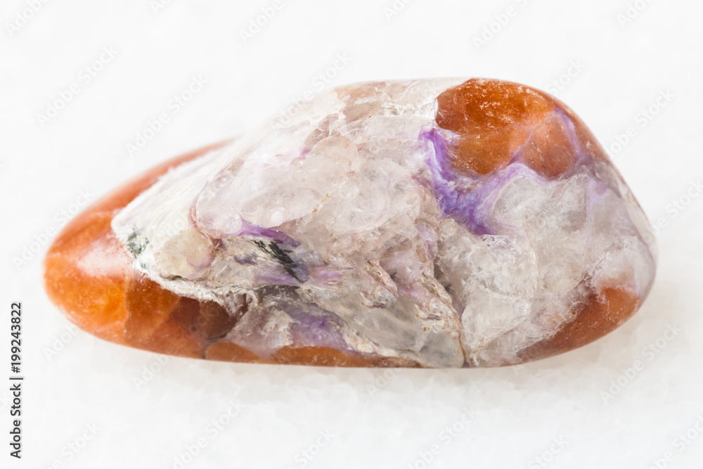 charoite in polished Tinaksite gemstone on white charoite in polished Tinaksite gemstone on white