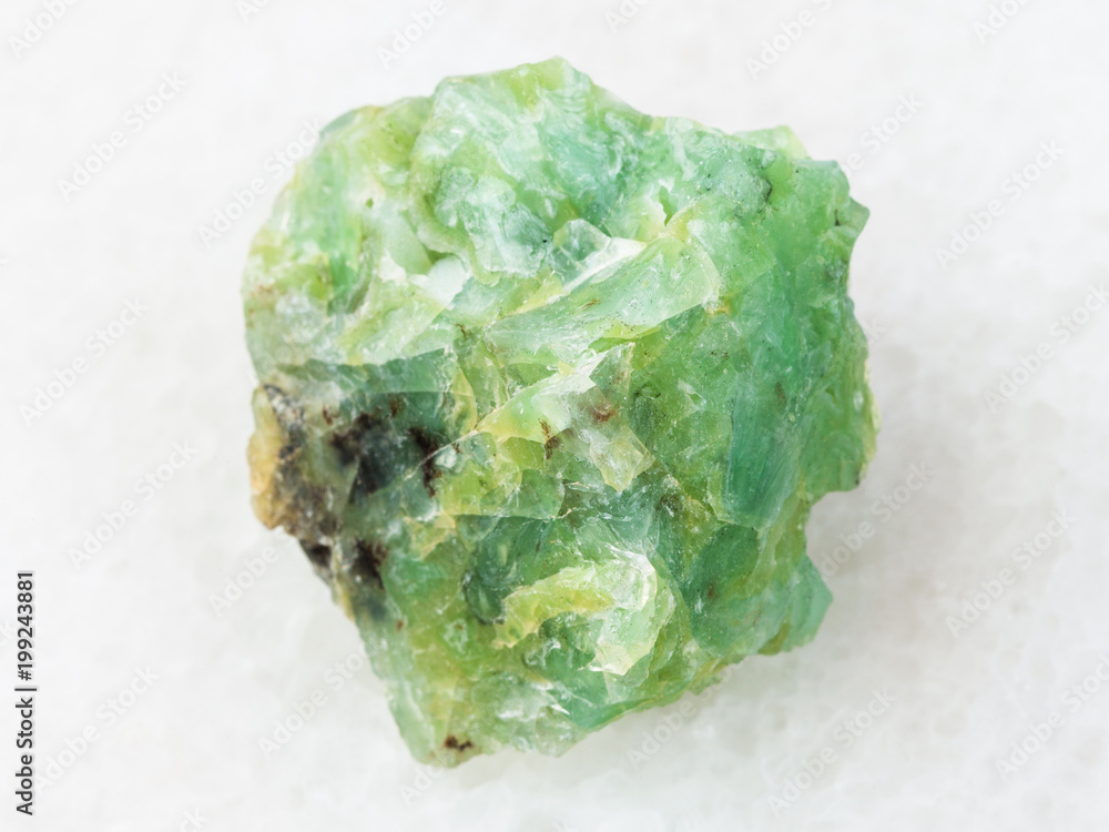 raw crystal of chrysopal gemstone on white raw crystal of chrysopal gemstone on white