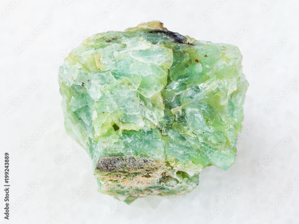 rough crystal of chrysopal gemstone on white rough crystal of chrysopal gemstone on white