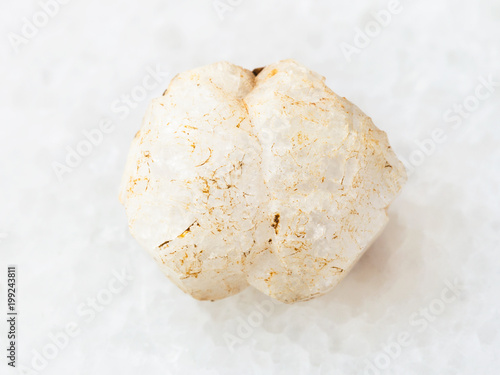 rough crystal of analcime gemstone on white photo