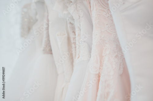 White modern wedding dresses in dress store.