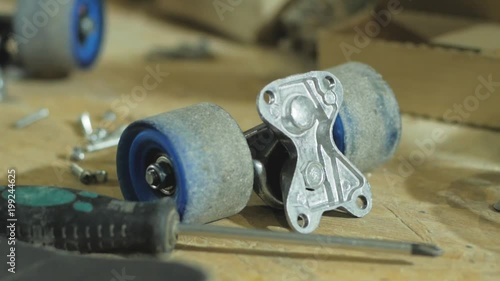 Parts of skateboard on the table, workshop or skatebording store photo