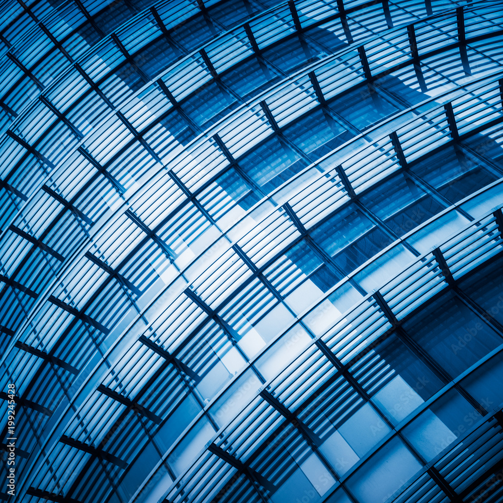 full frame of modern glass building,blue toned. full frame of modern glass building,blue toned.