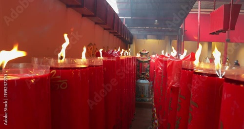 JAKARTA - Indonesia. March 26, 2018: Many burning red candles in the Jin De Yuan Templeat Petak Sembilan located in the Chinatown Glodok. Shot in 4k resolution photo
