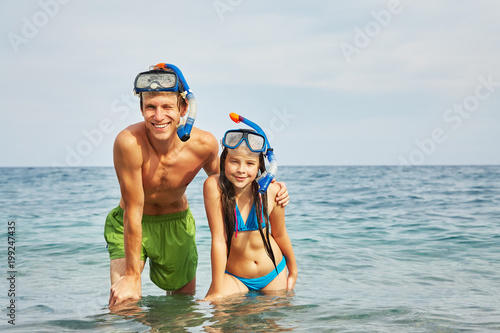 Dad and daughter in the sea