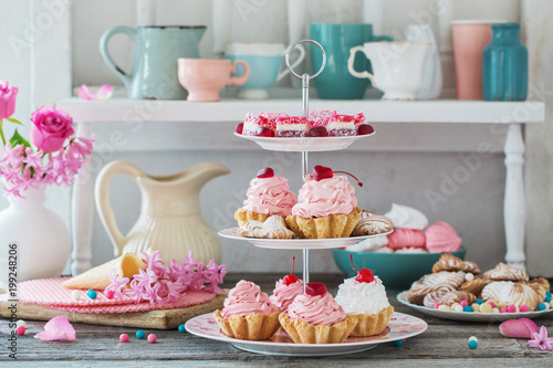 pink cakes on plate on white background