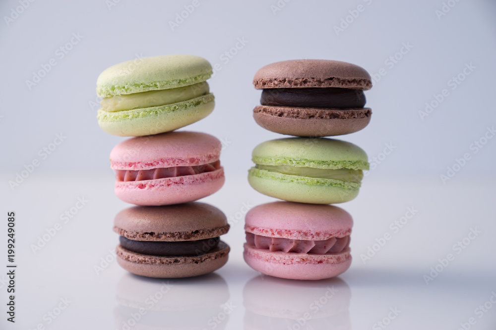 Colorful macaroons stacked on white background Colorful macaroons stacked on white background