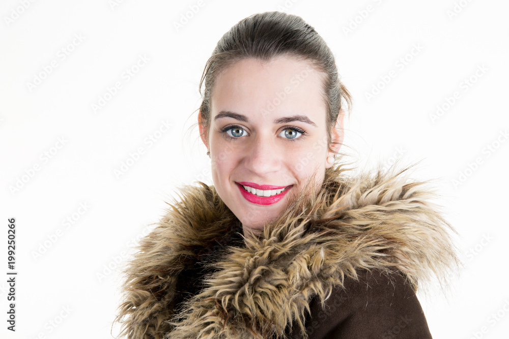pretty young woman face in portrait with a jacket of winters in fur animal hair pretty young woman face in portrait with a jacket of winters in fur animal hair